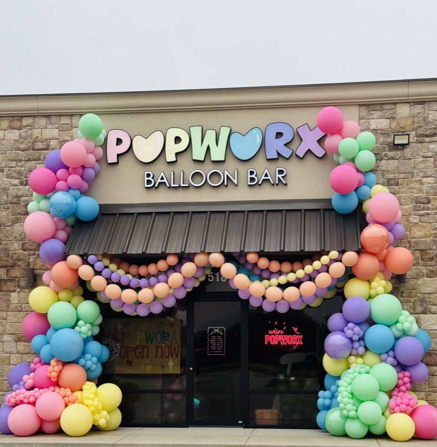 The Balloon Bar wrapped in pastel organic balloons